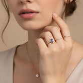 A delicate marquise sapphire ring and a pair of diamonds