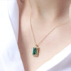 Emerald baguette gold necklace and diamonds