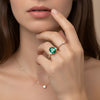 Gold ring set with 2.51 carat emerald and diamonds