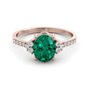 Gold ring set with 2.51 carat emerald and diamonds