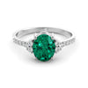 Gold ring set with 2.51 carat emerald and diamonds