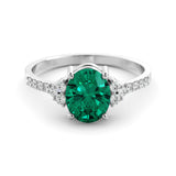 Gold ring set with 2.51 carat emerald and diamonds