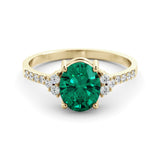 Gold ring set with 2.51 carat emerald and diamonds