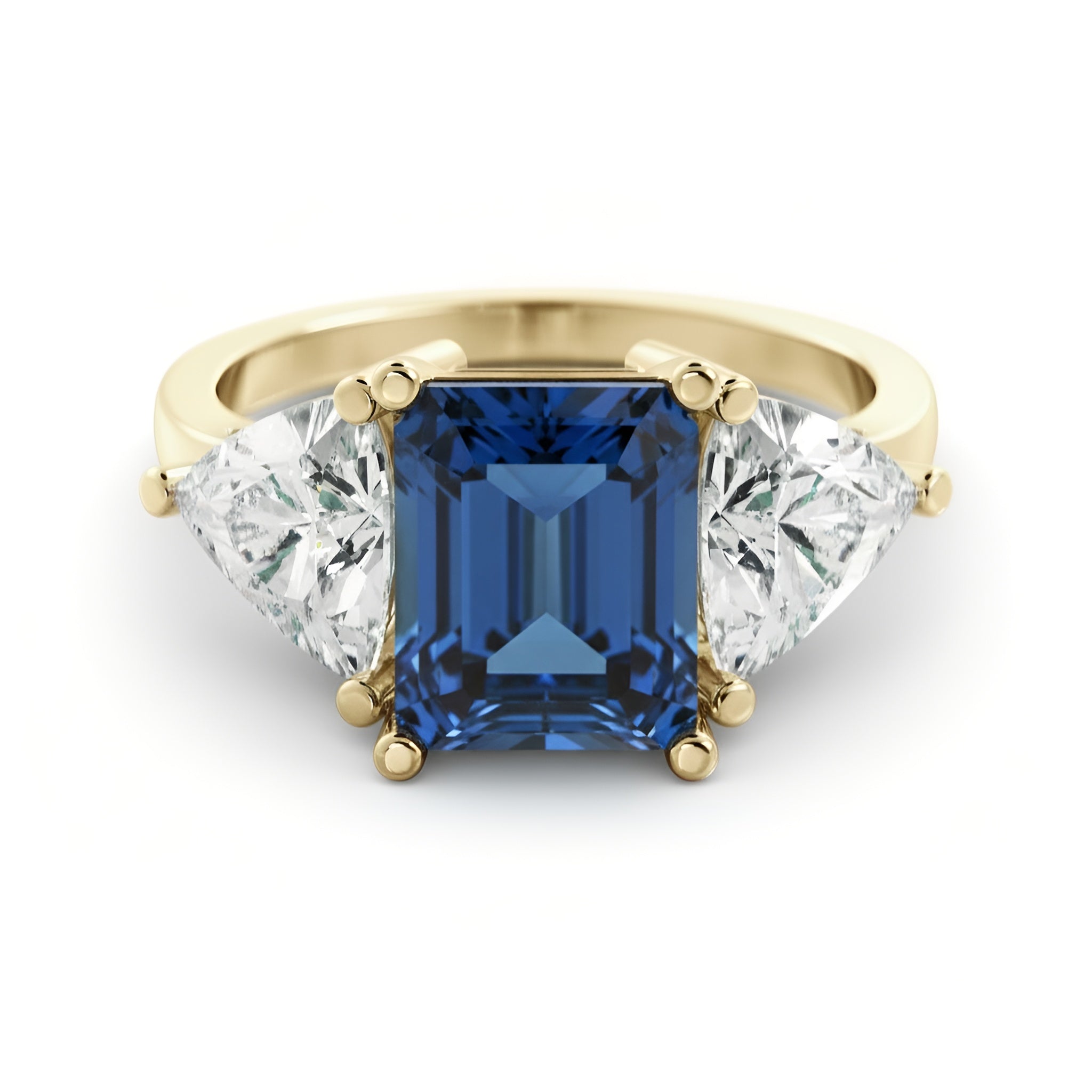 A gold ring with a large blue gemstone in the center, flanked by two smaller diamonds on either side.