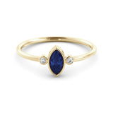 A delicate marquise sapphire ring and a pair of diamonds