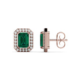 A pair of Halo emerald and diamond earrings