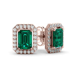 A pair of Halo emerald and diamond earrings