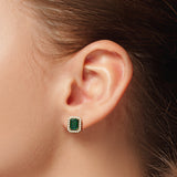 A pair of Halo emerald and diamond earrings
