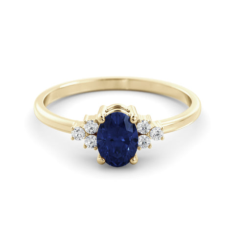 A delicate emerald and diamond ring