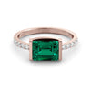 1.45 carat emerald ring and ten diamonds
