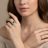 Spectacular halo emerald and diamond ring