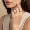 A delicate signet ring set with emeralds and diamonds