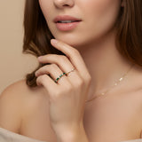 Delicate emerald baguette and diamond ring