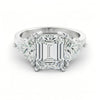 A stunning diamond engagement ring with a large, brilliant-cut diamond in the center, surrounded by smaller diamonds on either side.