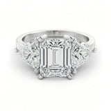 A stunning diamond engagement ring with a large, brilliant-cut diamond in the center, surrounded by smaller diamonds on either side.