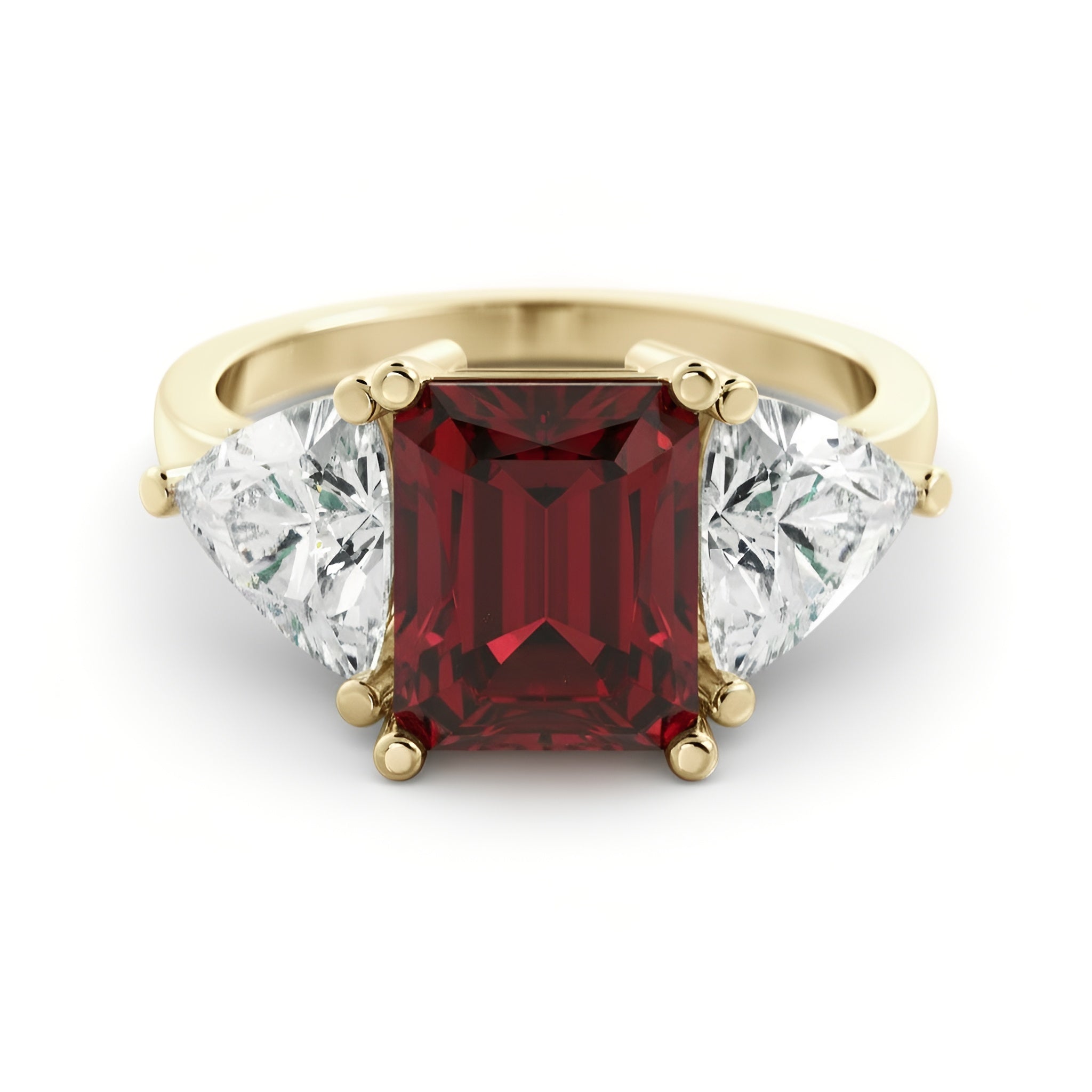 A gold ring with a large red gemstone in the center, flanked by two smaller diamonds on either side.